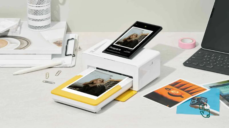 Photo printer on desk, HP Sprocket mini photo printer, Canon SELPHY CP1500, Epson SureColor P700, portable photo printer in action @ pickoutright.com