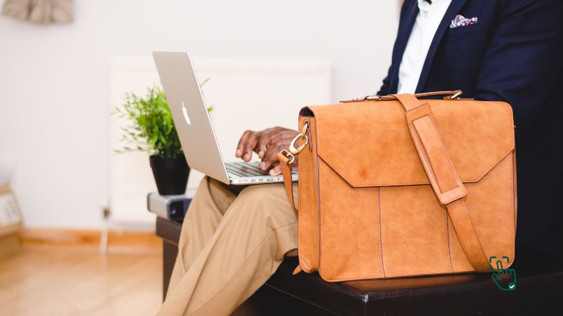 Leather laptop bag on a desk, stylish leather laptop tote, professional leather briefcase, Samsonite leather slim briefcase, vintage messenger bag.